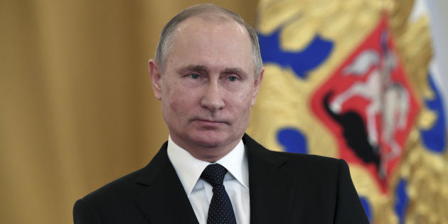 Russian President Vladimir Putin attends a state awards ceremony for military personnel who served in Syria, at the Kremlin in Moscow