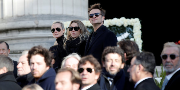 Johnny Hallyday's wife Laetitia Hallyday, Laura Smet and David Hallyday stand outside the La Madeleine Church prior to the funeral ceremony in tribute to late French singer Johnny Hallyday in Paris