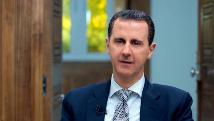 Syria's President Bashar al-Assad speaks during an interview with AFP news agency in Damascus
