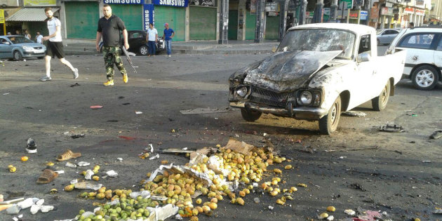 Damages after a suicide bomb attack are seen in Sweida