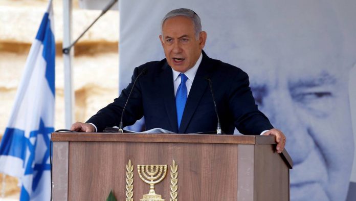 Israeli Prime Minister Benjamin Netanyahu speaks during an annual state memorial ceremony for Israel's first prime minister, David Ben Gurion, at his gravesite in Sde Boker Israel