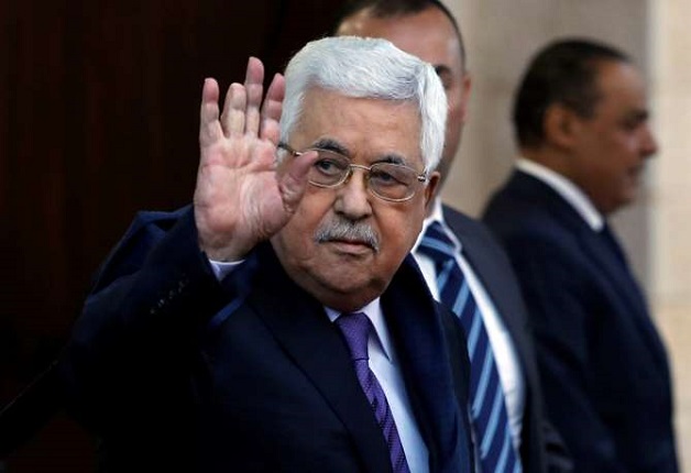 Palestinian President Mahmoud Abbas waves in Ramallah, in the occupied West Bank