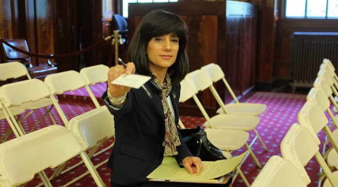 Judge Rachel Freier offers her business card in the ny city