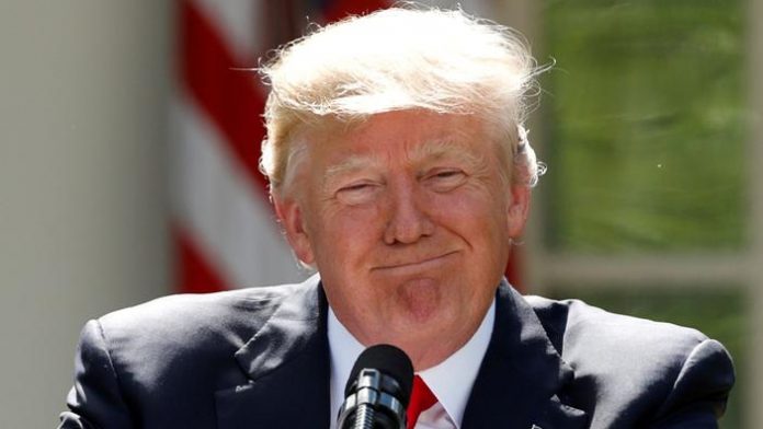 FILE PHOTO: U.S. President Trump pauses as he announces his decision to withdraw from Paris Climate Agreement at White House in Washington