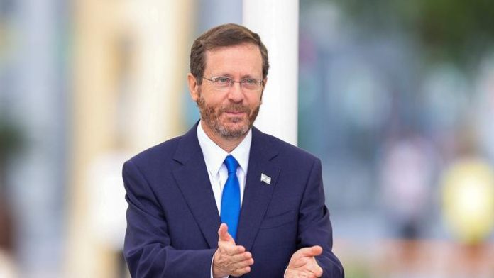 Israeli President Isaac Herzog stands to speak during Israel's National Day ceremony at Expo 2020 Dubai, in Dubai
