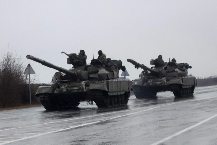 Ukrainian tanks move into the city, after Russian President Vladimir Putin authorized military operation in eastern Ukraine, in Mariupol