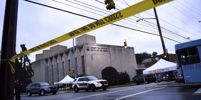 TOPSHOT - Police tape is viewed around the area on October 28