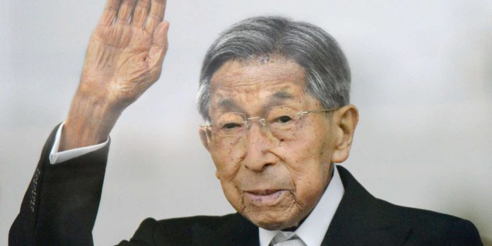 Japanese Prince Mikasa waves to well-wishers during a public appearance for a New Year celebration at the Imperial Palace in Tokyo